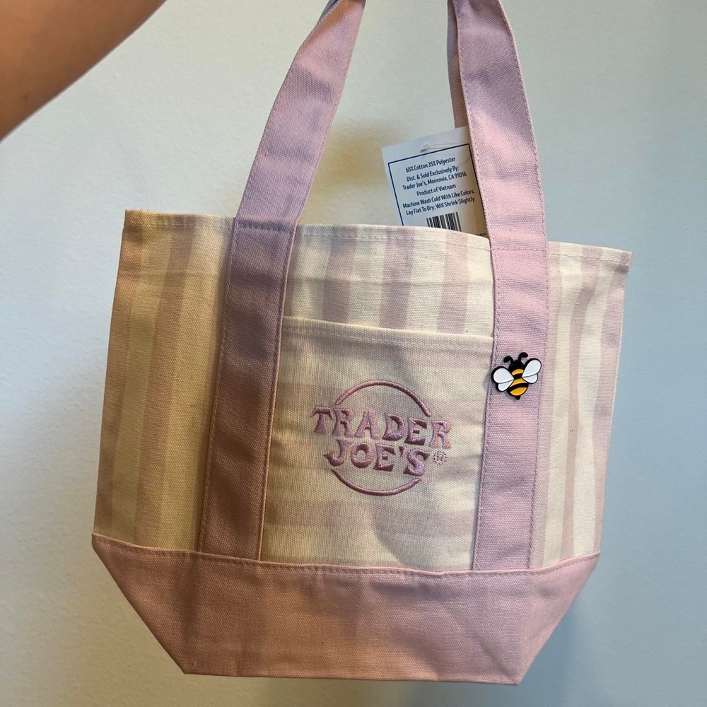 Pink and cream striped Trader Joe's mini canvas tote bag with bee pin